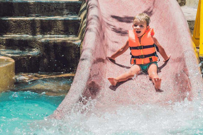 Photo of a child on a water slide to illustrate pre-focusing your camera before taking a picture.