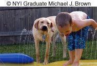 This is a great 'grab shot,' meaning that the photographer sees something happening, and without too much time of position the camera 'grabs' the shot. Any attempt to pose the picture would lose the candid feel and sense of spontaneity. NYIP graduate Michael J. Brown should be proud of capturing this moment forever. © NYIP Graduate Michael J. Brown