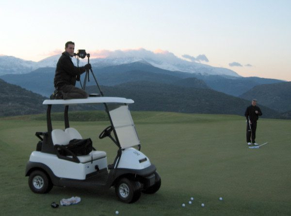 What it's all about — flying to the other side of Europe so I can crouch on top of a golf buggy at sunset in the freezing cold to photograph a pro golfer.