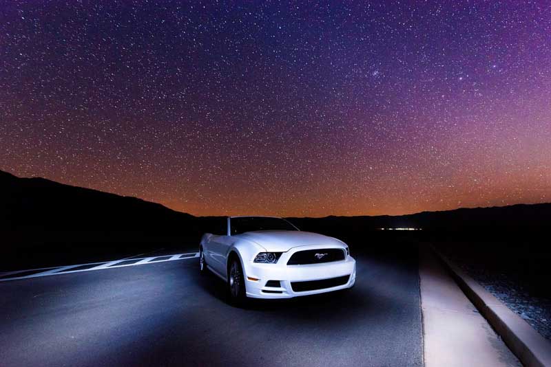 Lighting up a car in the desert with a flashlight