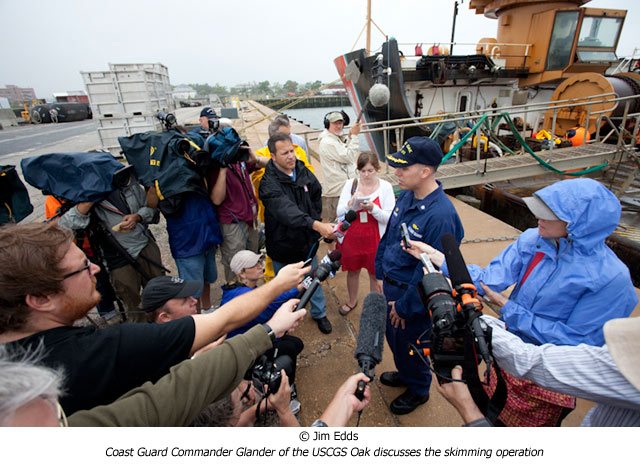 Coast Guard Commander Glander of the USCGS Oak discusses the skimming operation