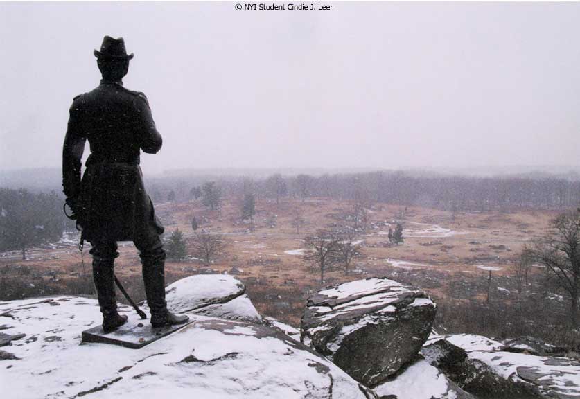 Statue in the Snow by NYIP Student Cindie J. Leer